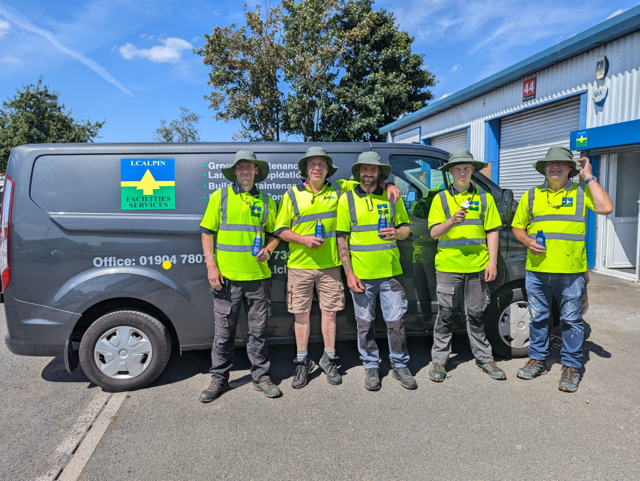 Ian Calpin small team with van at job site