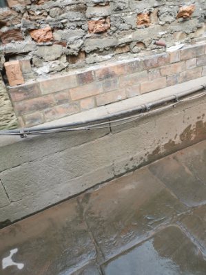 clean new wall blending into existing structure
